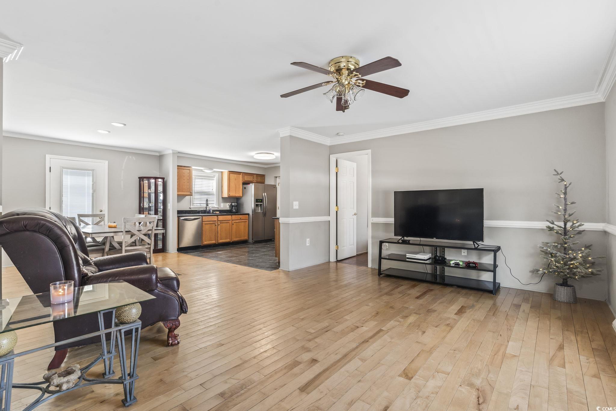 2192 Bell Road Longs, SC 29568 - Photo 3 of 19 Living area with ornamental molding, wood-type flo