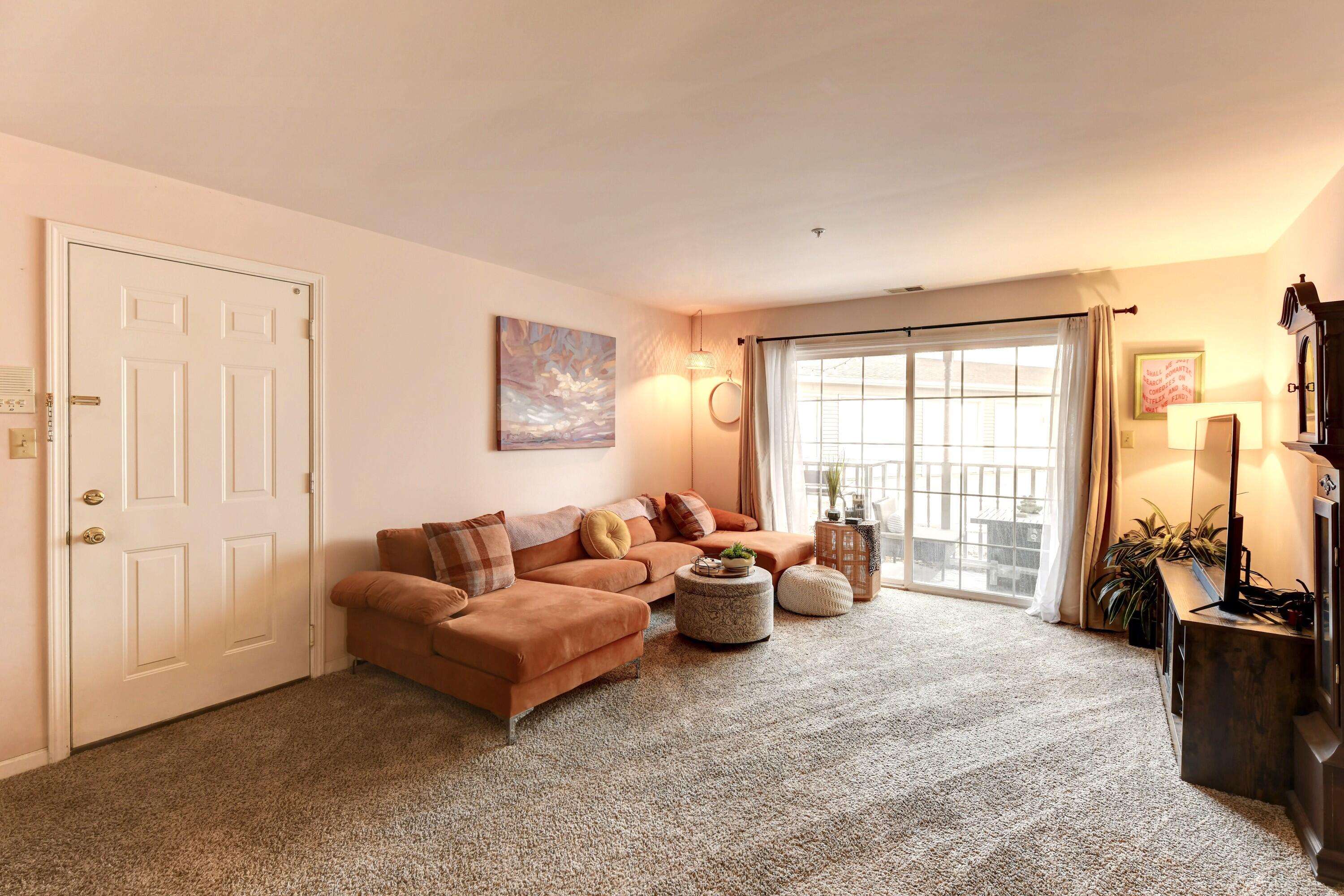 2343 99th Street, Unit 1A Highland, IN 46322 - Photo 4 of 18 a living room with furniture and large windows
