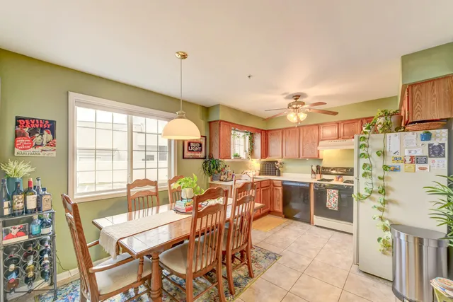 a view of a dining room with furniture window and outside view