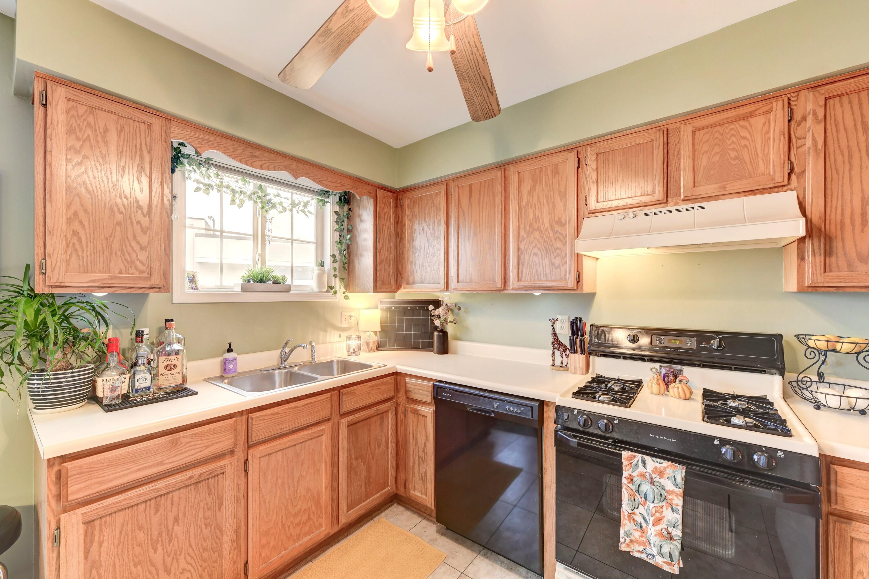 2343 99th Street, Unit 1A Highland, IN 46322 - Photo 9 of 18 a kitchen with a sink stove top oven and cabinets