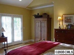 11207 Asbury Chapel Road Huntersville, NC 28078 - Photo 6 of 8 a bedroom with a bed and a dresser