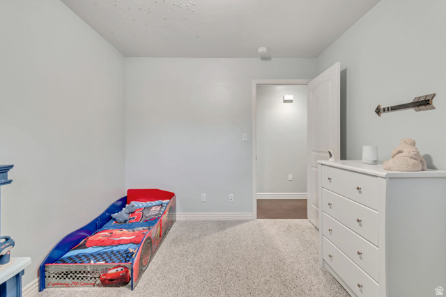 356 North 230 West Payson, UT 84651 - Photo 20 of 45 Carpeted room featuring light blue painted walls, white baseboards, and a white interior door with a silver knob