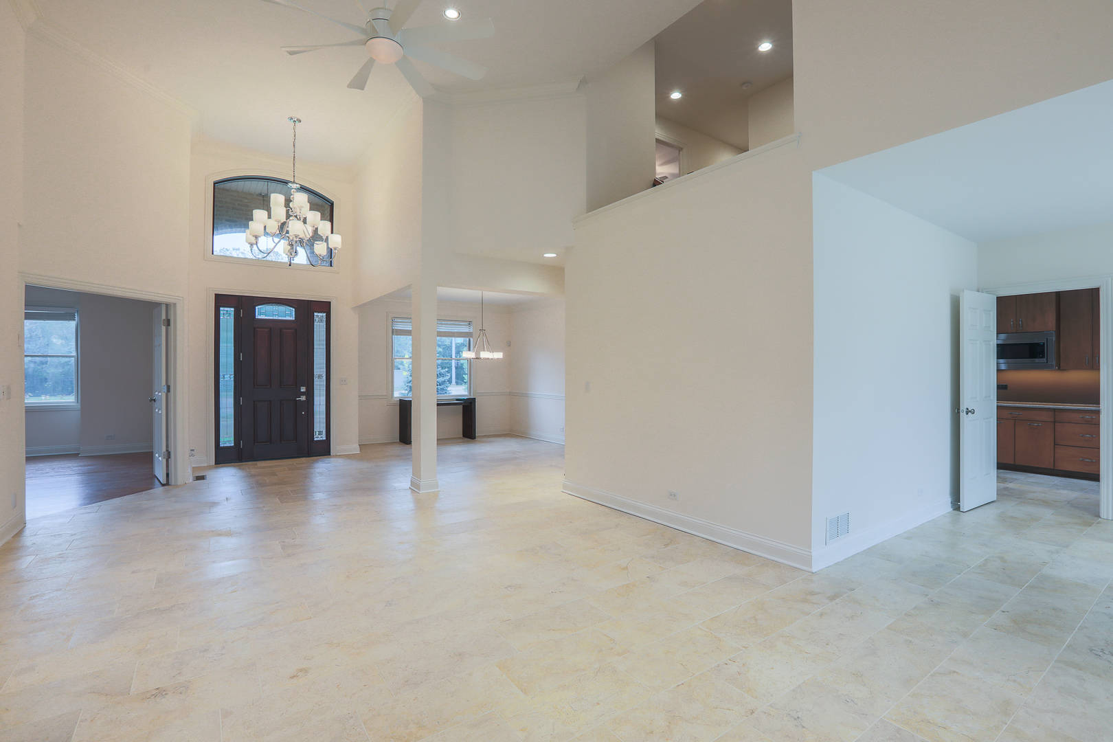 7820 South County Line Road Burr Ridge, IL 60527 - Photo 11 of 40 an empty room and chandelier in hallway
