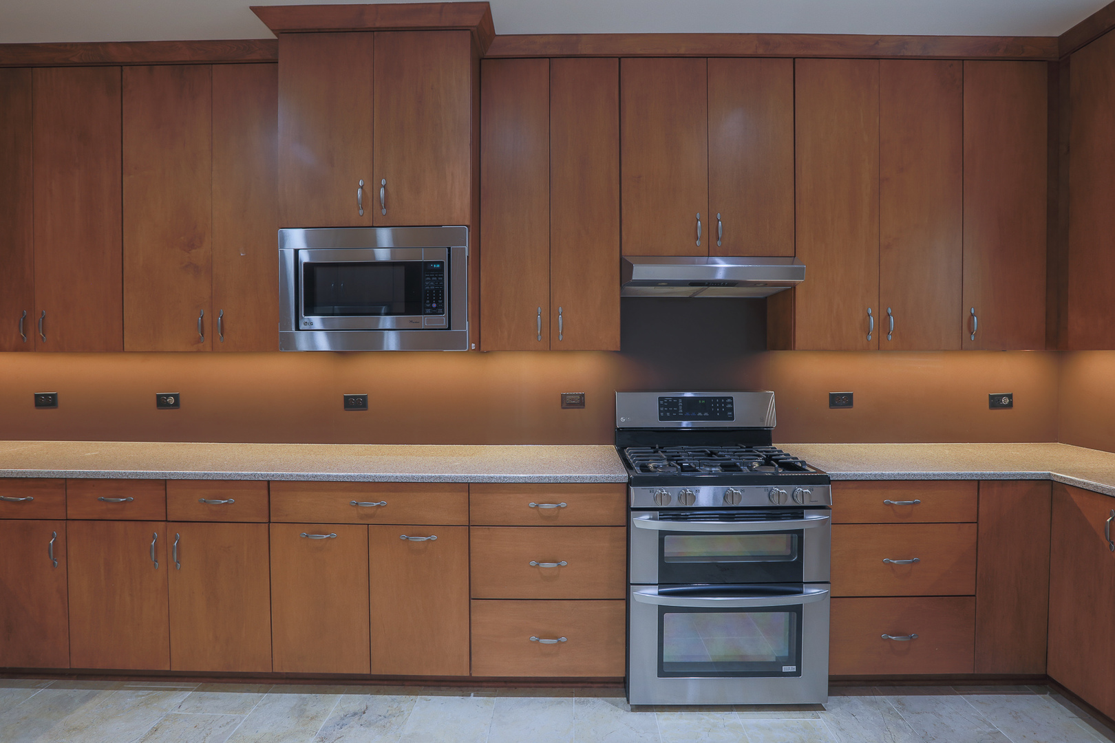 7820 South County Line Road Burr Ridge, IL 60527 - Photo 14 of 40 a kitchen with granite countertop wood cabinets and stainless steel appliances