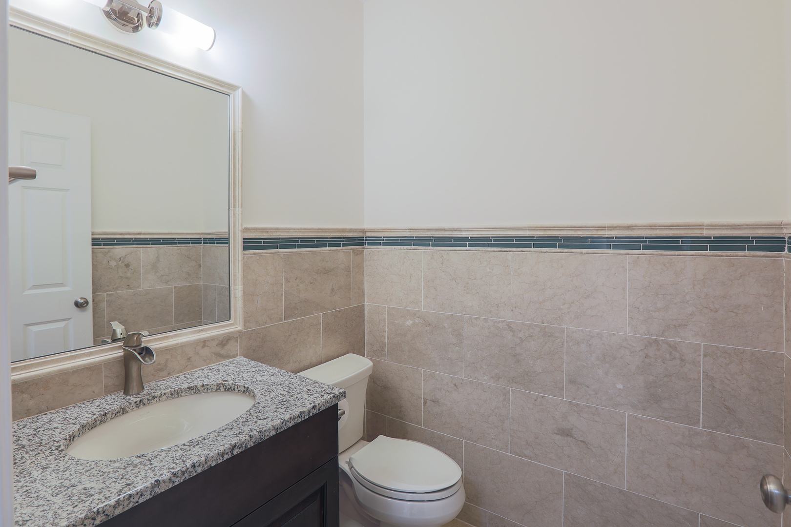 7820 South County Line Road Burr Ridge, IL 60527 - Photo 19 of 40 a bathroom with a granite countertop sink toilet and a mirror