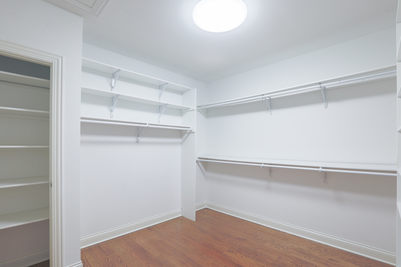 7820 South County Line Road Burr Ridge, IL 60527 - Photo 25 of 40 a view of an empty walk in closet