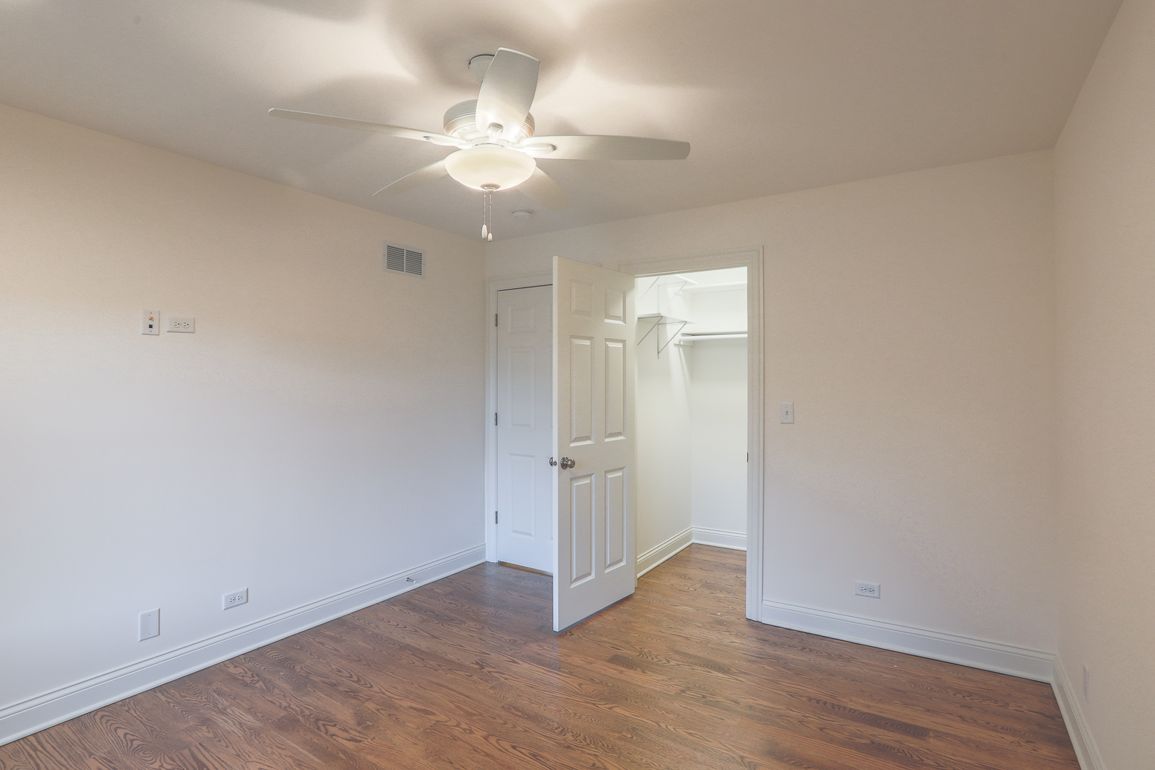 7820 South County Line Road Burr Ridge, IL 60527 - Photo 28 of 40 an empty room with wooden floor