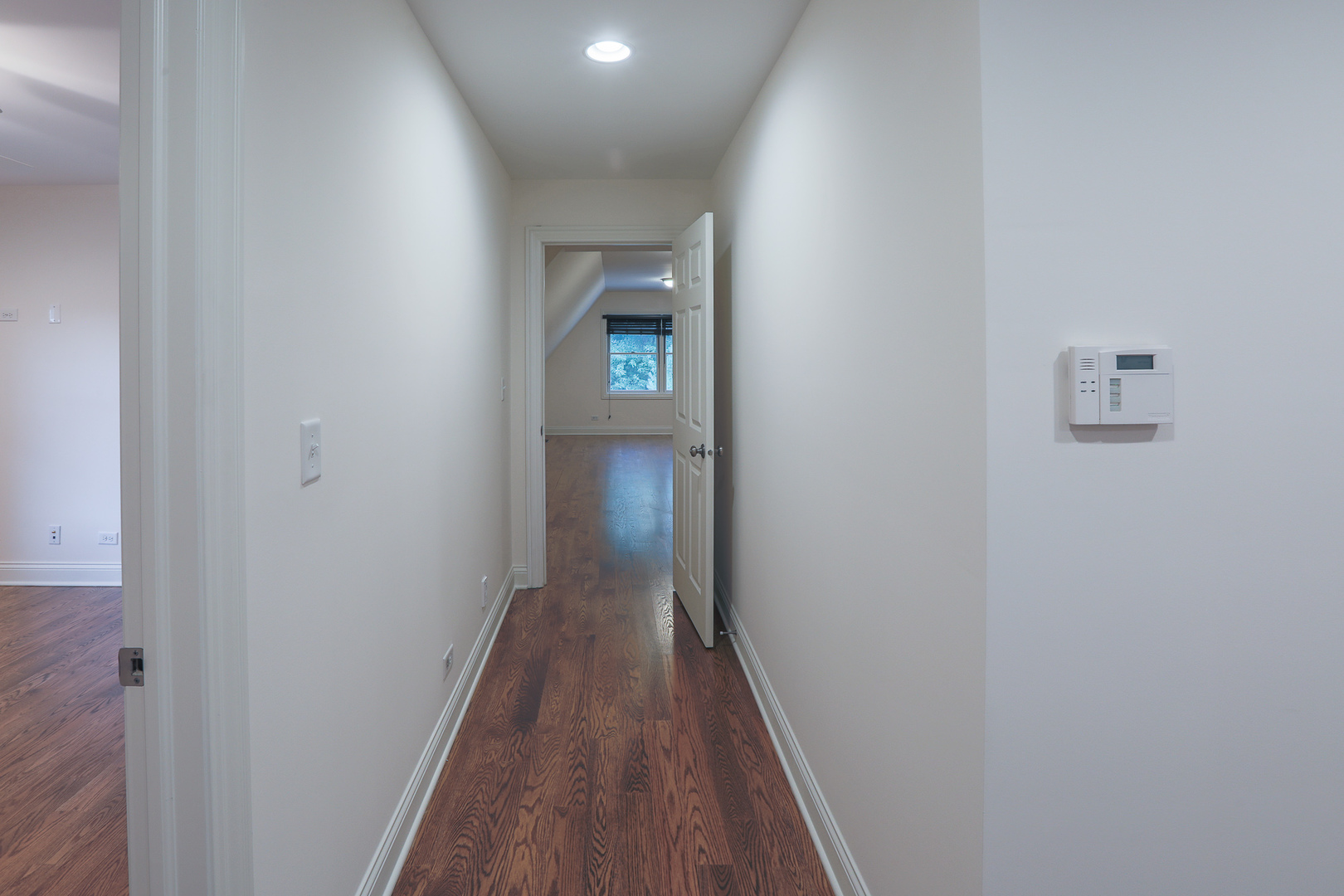 7820 South County Line Road Burr Ridge, IL 60527 - Photo 29 of 40 a view of a hallway with wooden floor