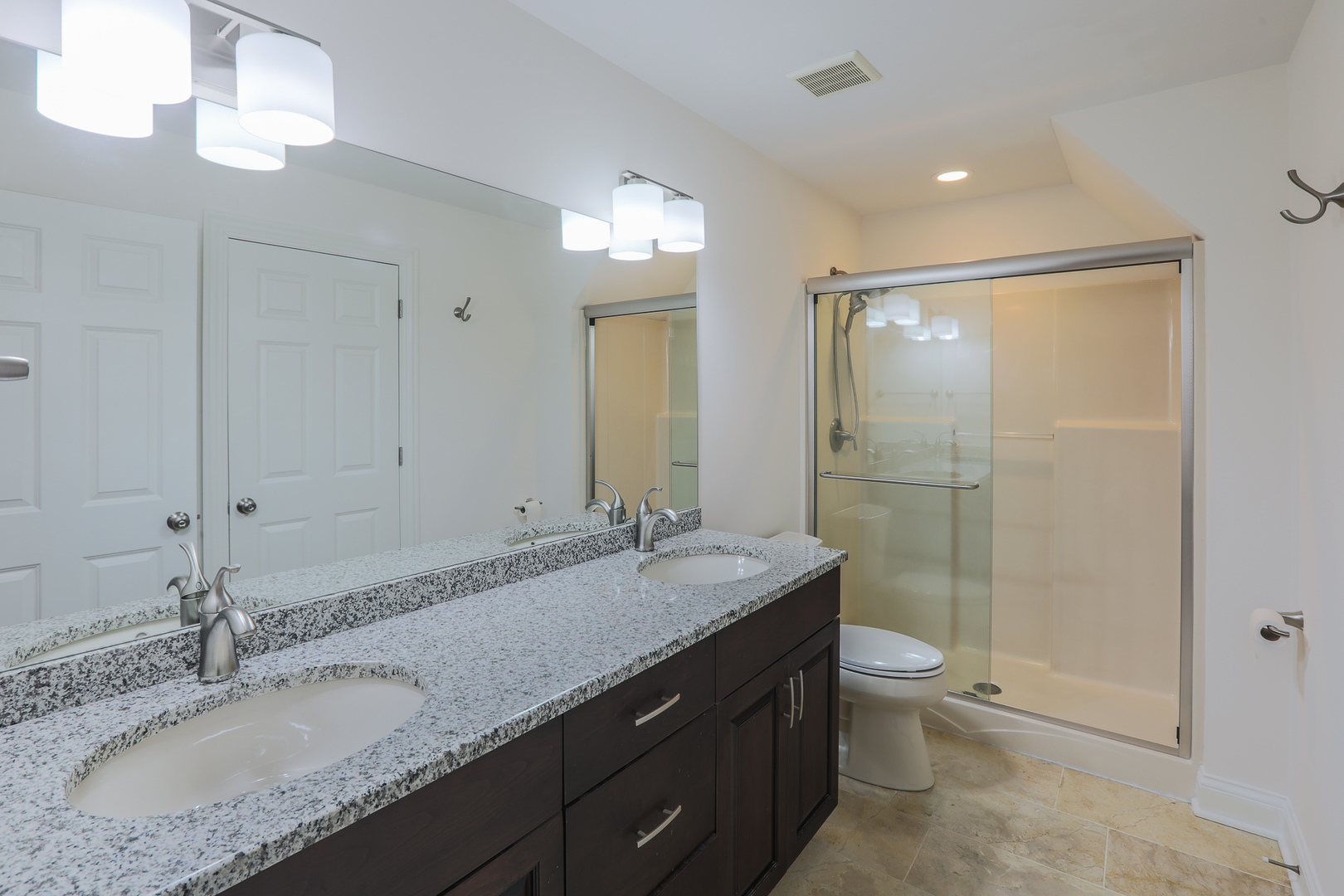 7820 South County Line Road Burr Ridge, IL 60527 - Photo 31 of 40 a bathroom with a granite countertop sink a toilet a mirror and shower