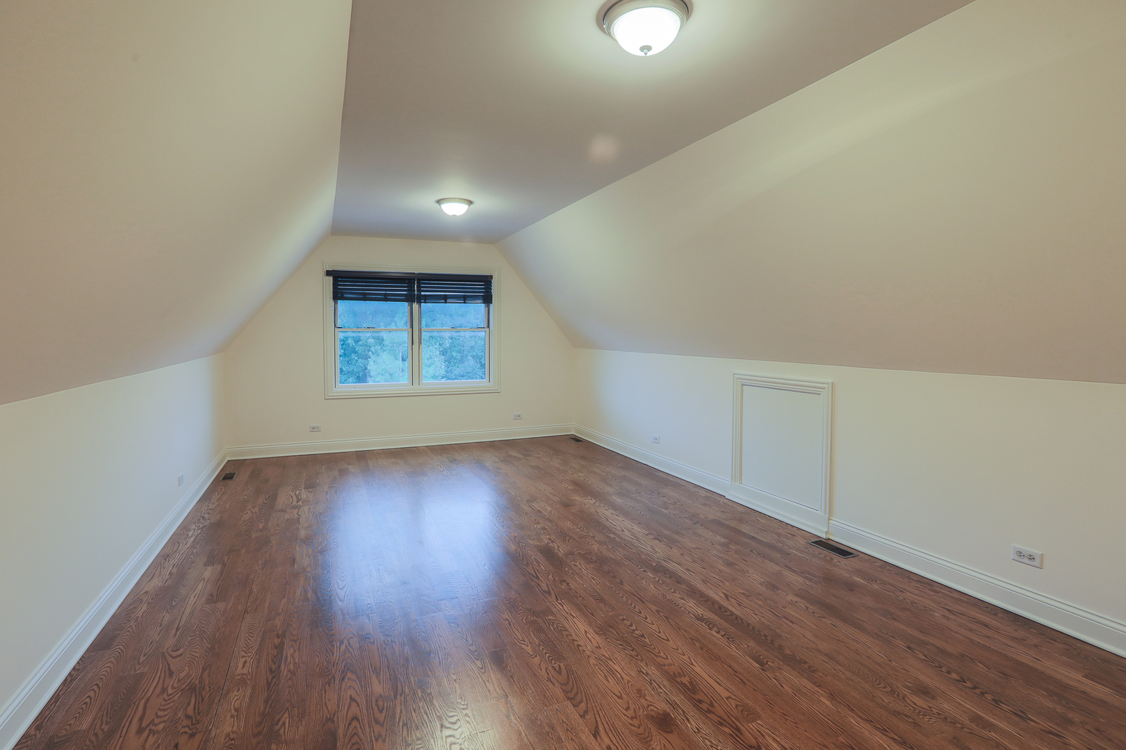 7820 South County Line Road Burr Ridge, IL 60527 - Photo 32 of 40 an empty room with wooden floor and windows