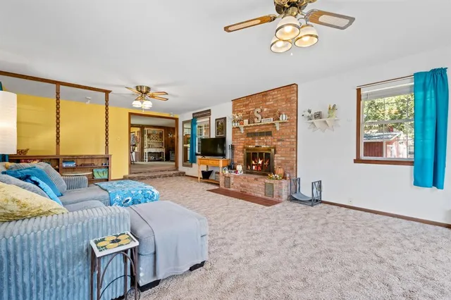 a view of a livingroom with furniture and a window