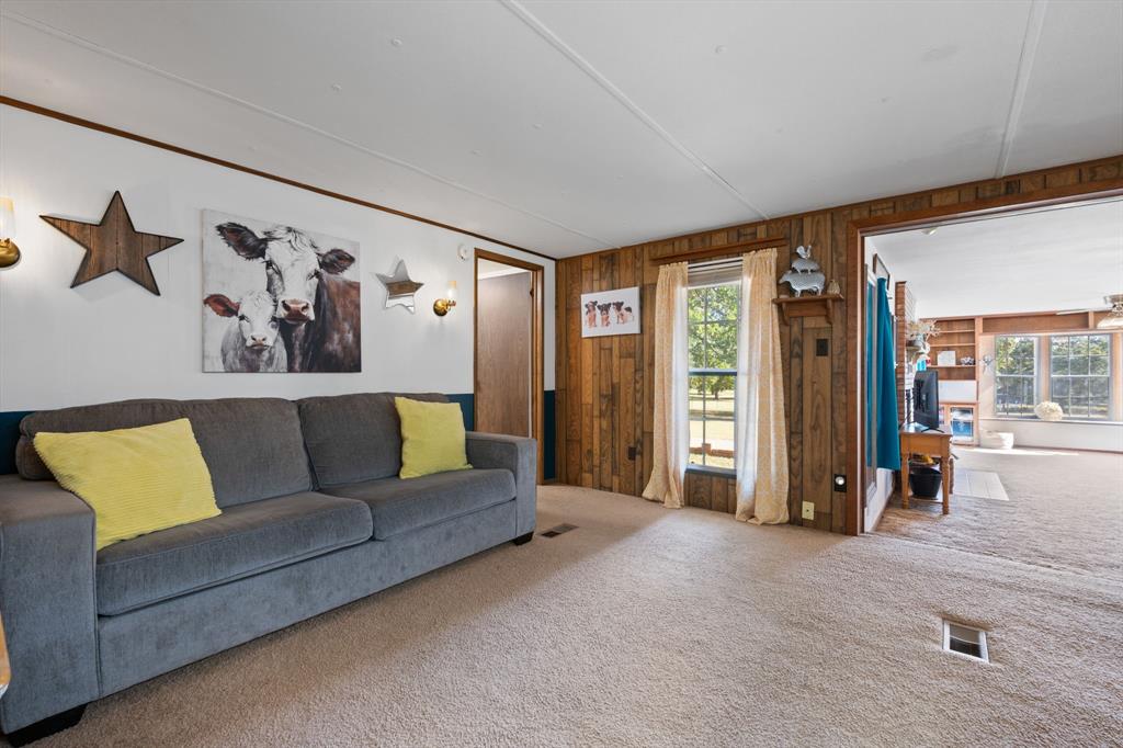 1500 County Road 404 Comanche, TX 76442 - Photo 14 of 39 a living room with furniture and a large window