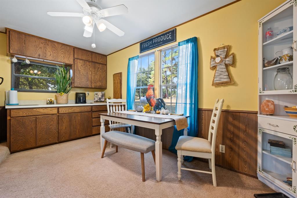 1500 County Road 404 Comanche, TX 76442 - Photo 20 of 39 a living room with furniture a flat screen tv and a window
