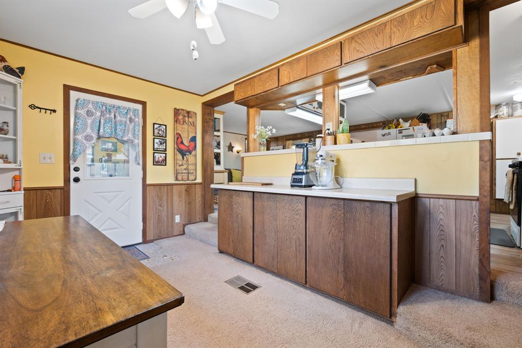 1500 County Road 404 Comanche, TX 76442 - Photo 21 of 39 a view of a hallway with furniture and wooden floor