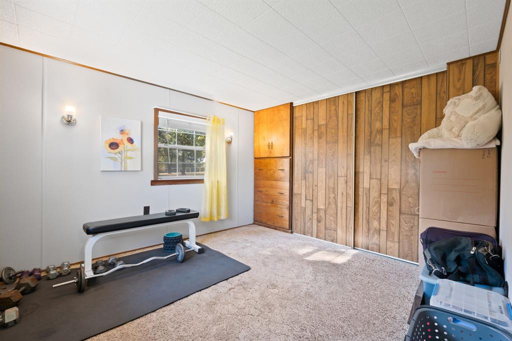 1500 County Road 404 Comanche, TX 76442 - Photo 29 of 39 a bedroom with furniture and a window