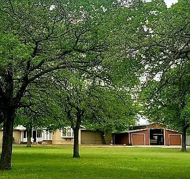1500 County Road 404 Comanche, TX 76442 - Photo 7 of 39 a view of a tree in a yard with a house