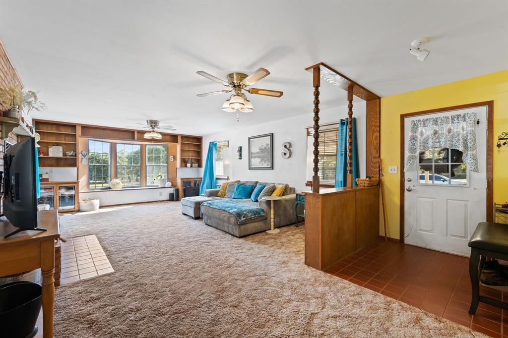 1500 County Road 404 Comanche, TX 76442 - Photo 8 of 39 a living room with furniture and a flat screen tv
