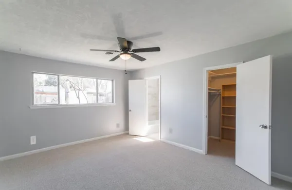 a view of an empty room with a window