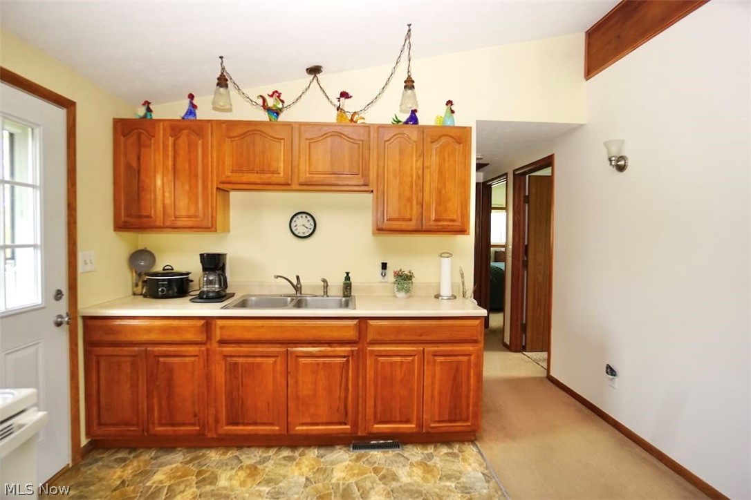 5875 Trumbull Road Geneva, OH 44041 - Photo 7 of 33 Bright & cheery kitchen sink area.
