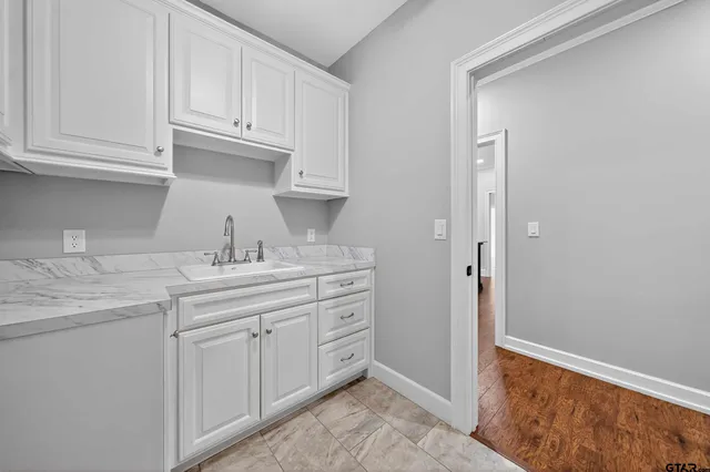 a kitchen with a sink and cabinets