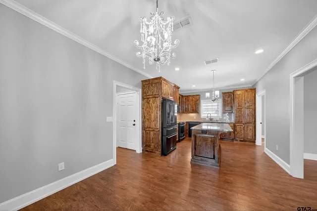 a view of a livingroom with furniture window and wooden floor