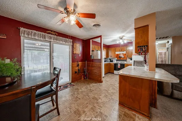 a dining room with furniture and window