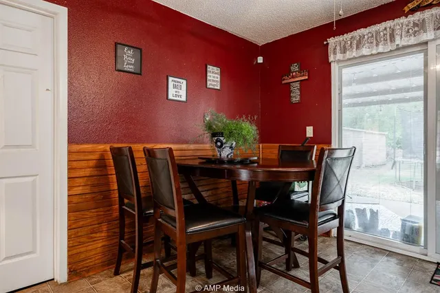 a kitchen with granite countertop stainless steel appliances and wooden cabinets