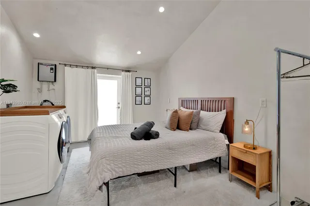 a bedroom with a bed and a couch