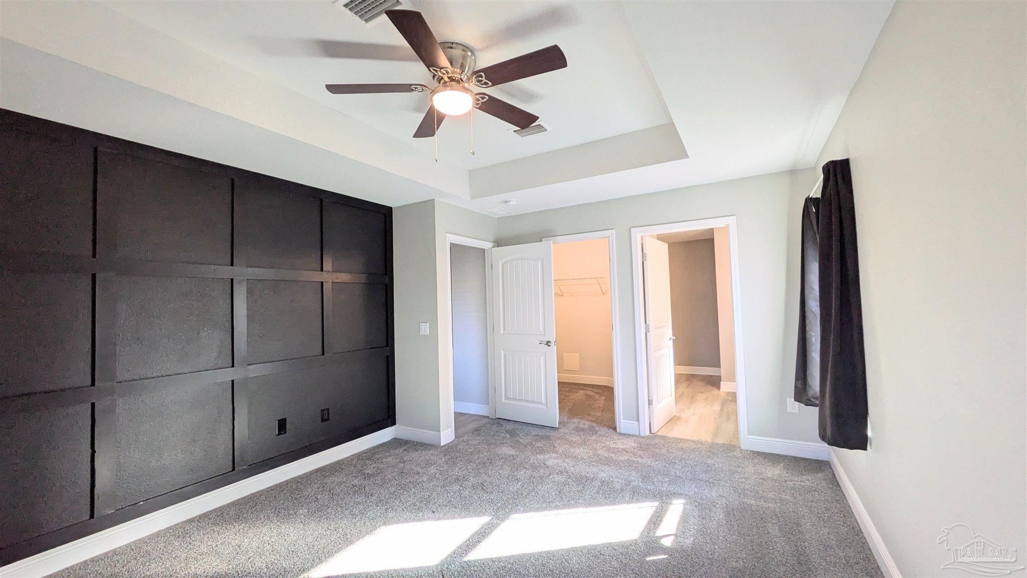 4417 Fiske Street Pace, FL 32571 - Photo 20 of 38 an empty room with closet and windows