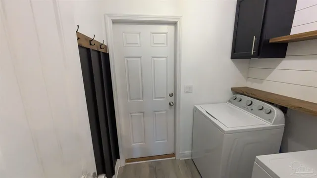 a utility room with dryer and washer