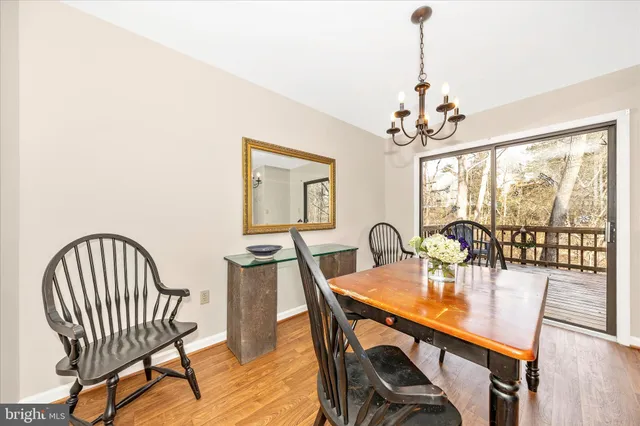 a kitchen with granite countertop a refrigerator and a stove top oven