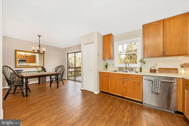 a kitchen with stainless steel appliances granite countertop a sink and cabinets