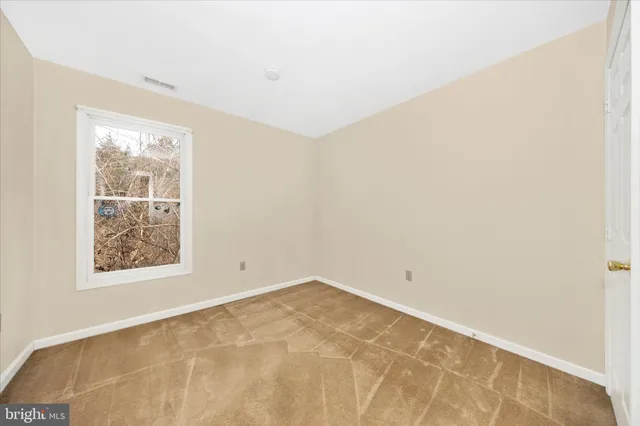 a view of a balcony with wooden floor and furniture