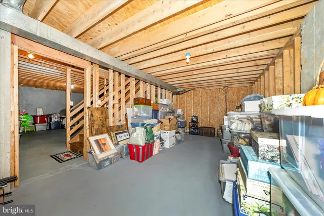 a view of a house with wooden fence