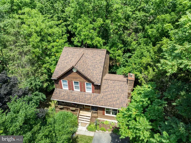 front view of a house with a tree