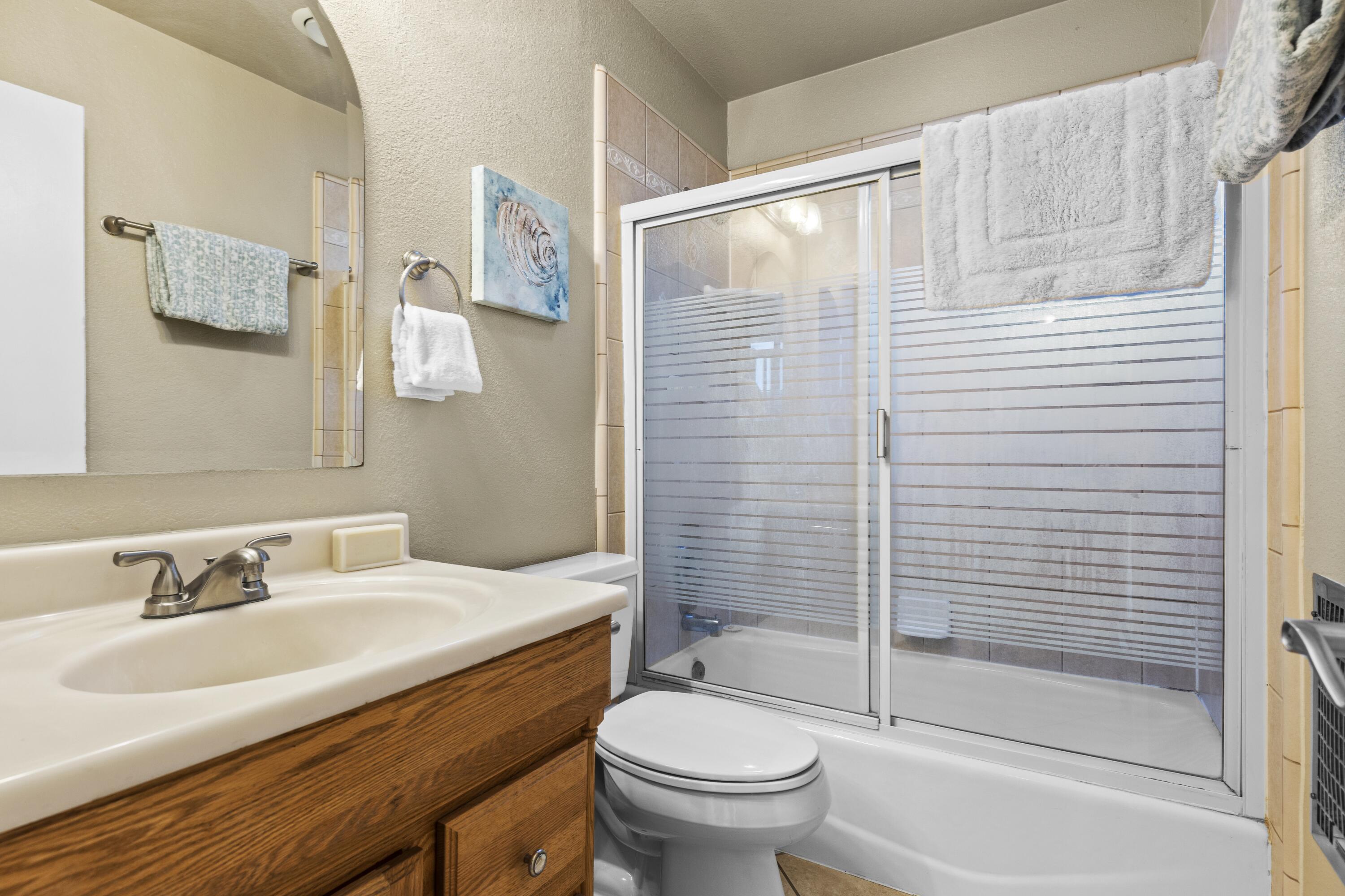 801 Beech Street Tehachapi, CA 93561 - Photo 21 of 24 a bathroom with a sink toilet and shower