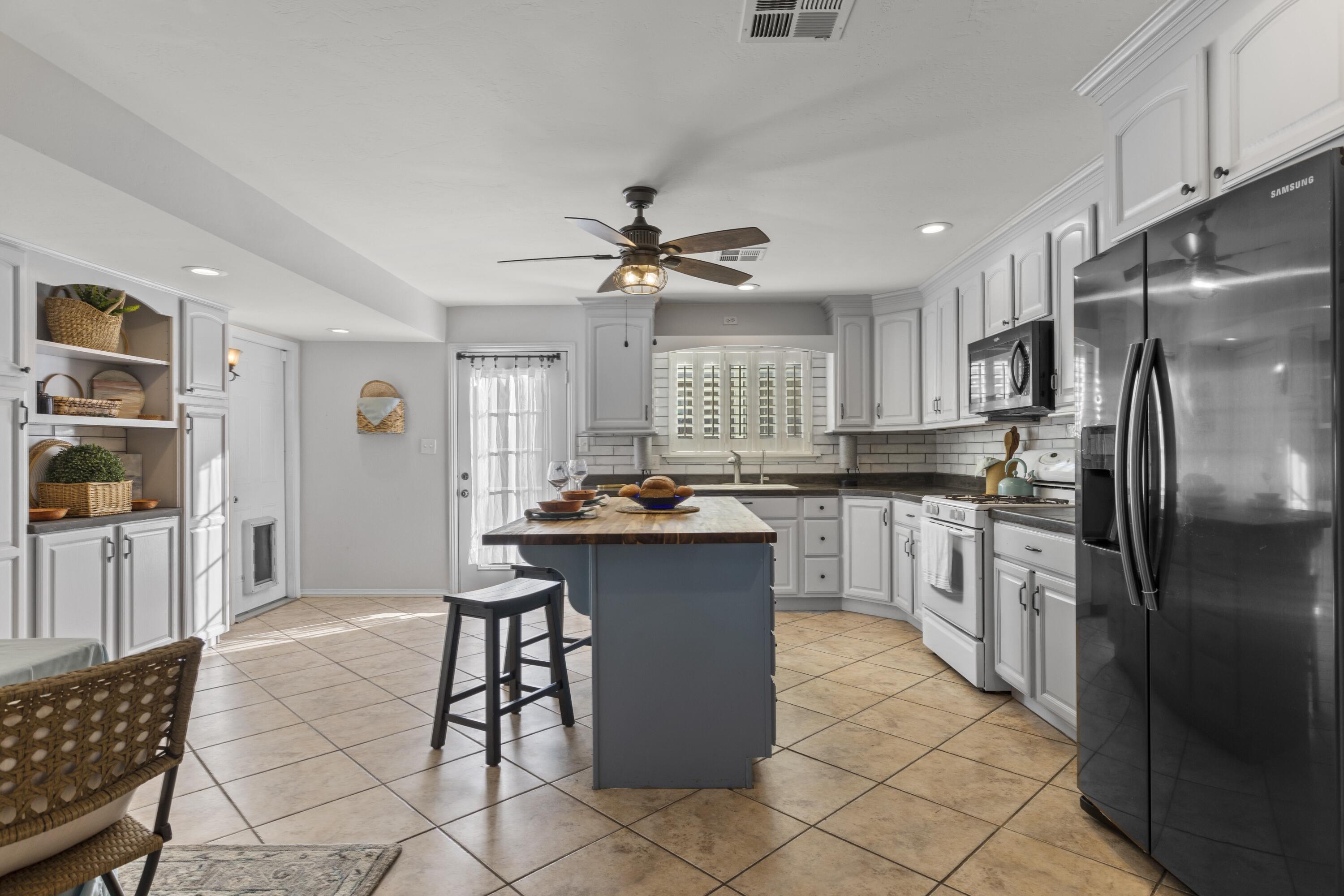 801 Beech Street Tehachapi, CA 93561 - Photo 10 of 24 a kitchen with cabinets and stainless steel appliances