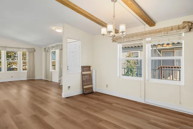 a kitchen with stainless steel appliances granite countertop a sink and a refrigerator