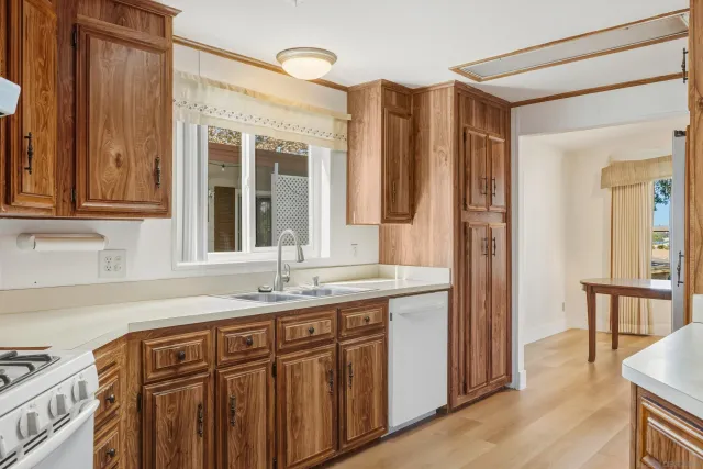 a view of a storage and utility room with washer and dryer