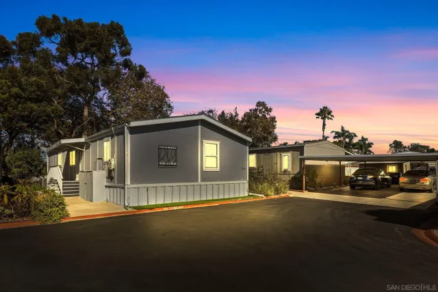 a view of a house with a yard and garage