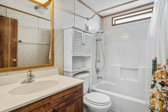 a room with a dresser and a mirror