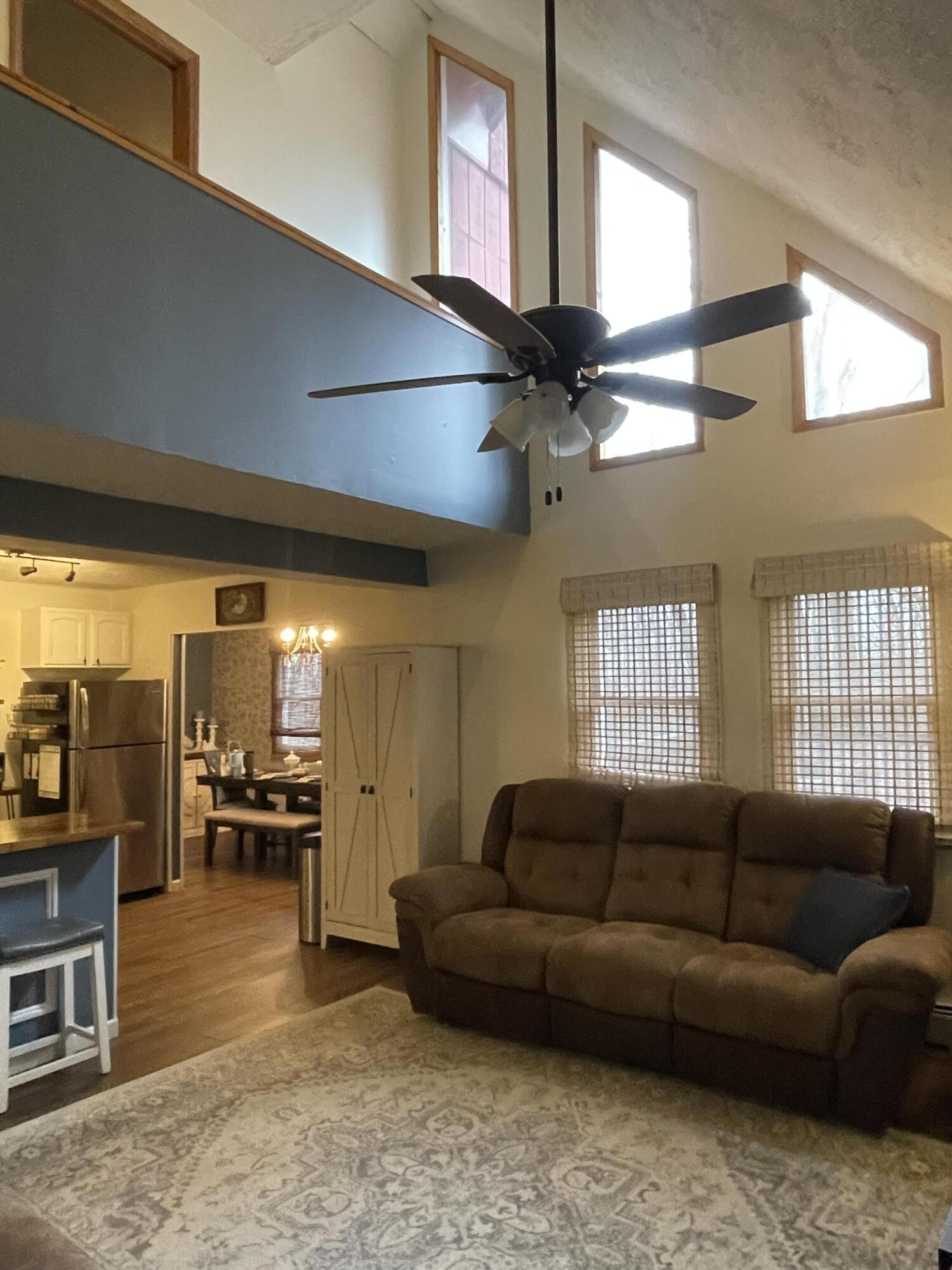 2122 Woodthrush Court Bushkill, PA 18324 - Photo 11 of 29 a living room with furniture and a large window