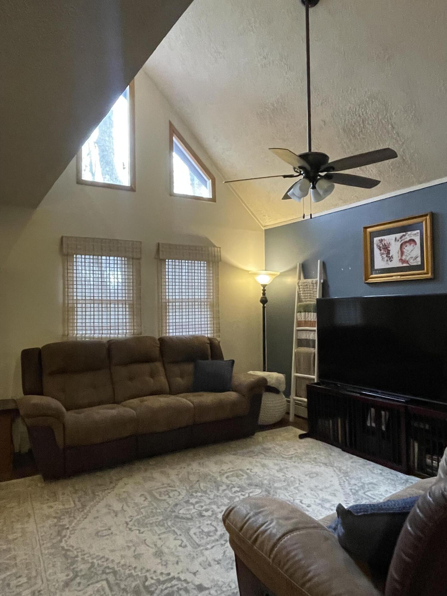 2122 Woodthrush Court Bushkill, PA 18324 - Photo 12 of 29 a living room with furniture and a flat screen tv