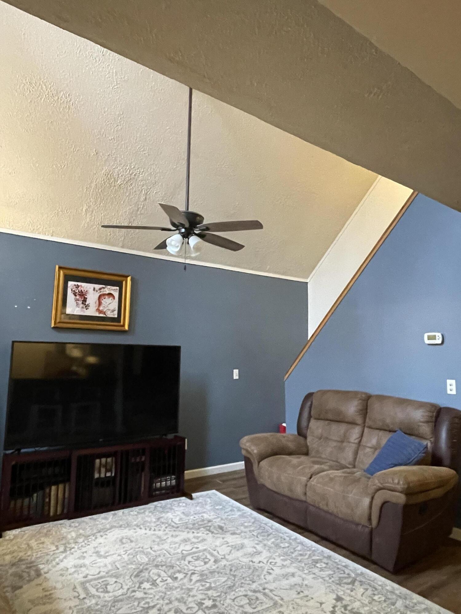 2122 Woodthrush Court Bushkill, PA 18324 - Photo 13 of 29 a living room with furniture and a flat screen tv