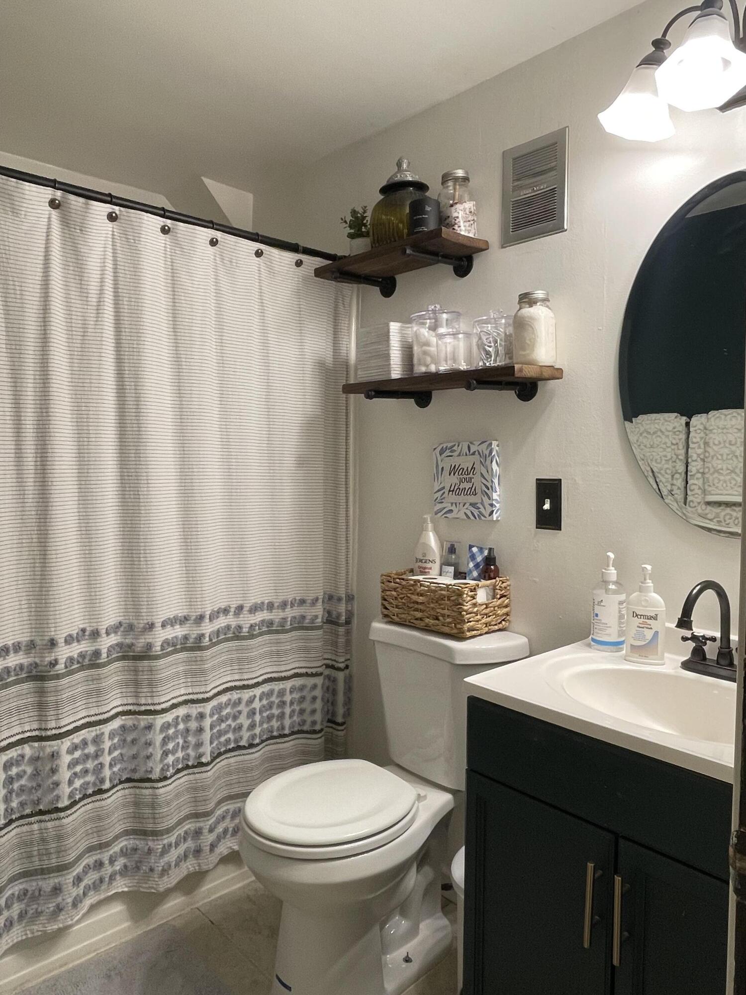 2122 Woodthrush Court Bushkill, PA 18324 - Photo 23 of 29 a bathroom with a sink a toilet and mirror