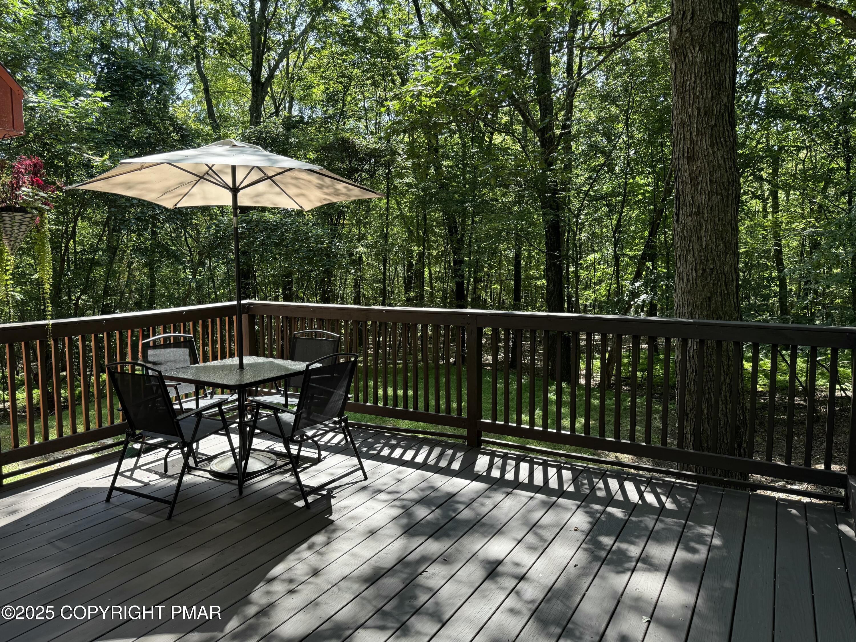 2122 Woodthrush Court Bushkill, PA 18324 - Photo 27 of 29 a view of a chair and table on the wooden floor