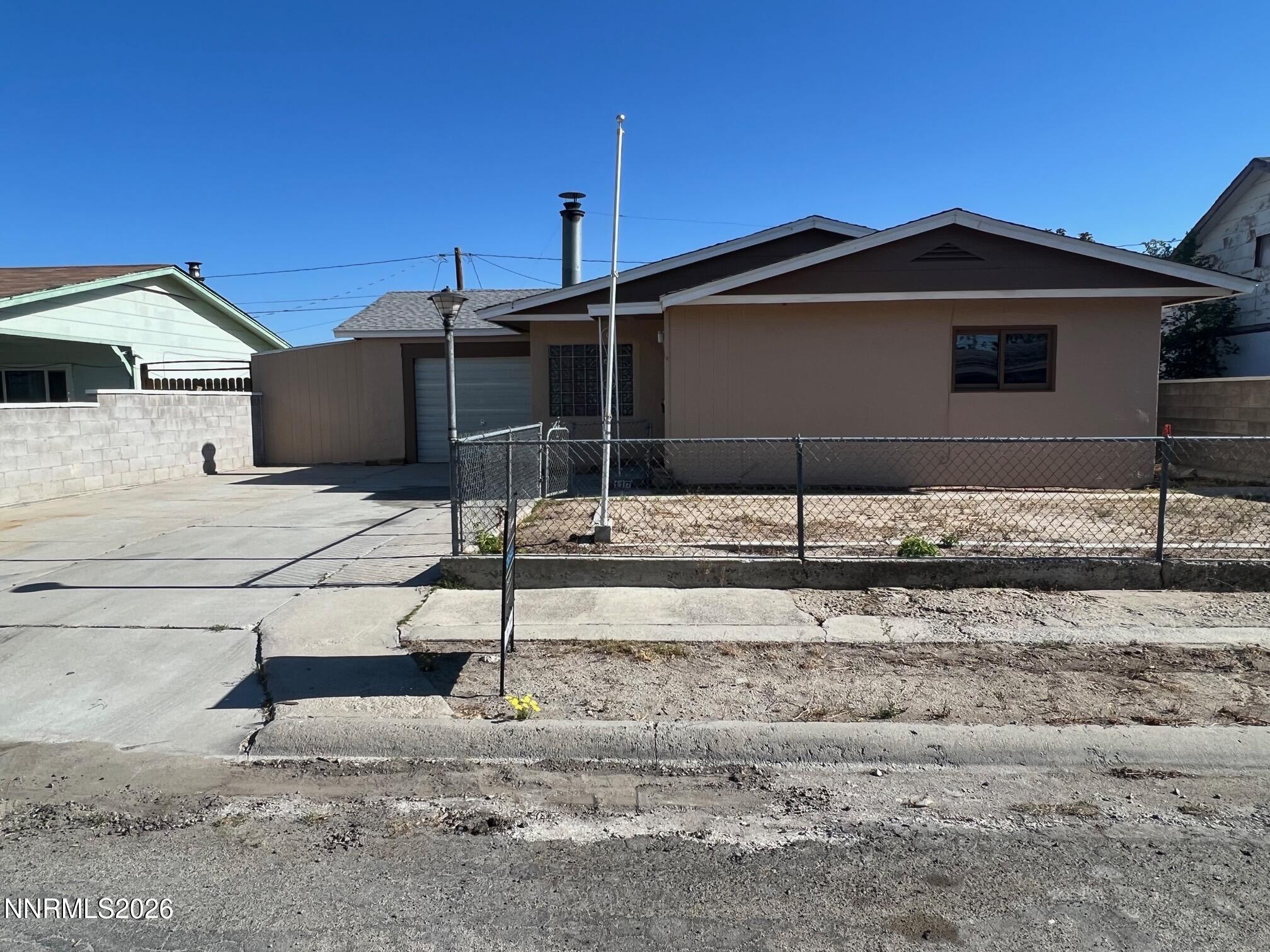 117 West 4th Street Hawthorne, NV 89415 - Photo 1 of 47 a backyard of a house with yard and parking space