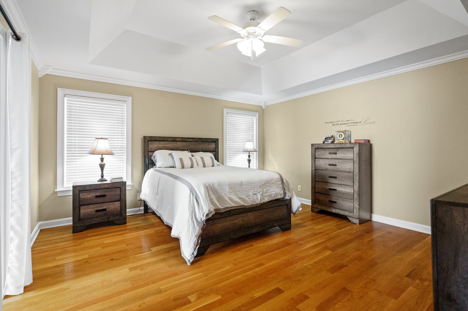 415 Woodruff Road Adams, TN 37010 - Photo 22 of 47 a bedroom with a bed and a chandelier