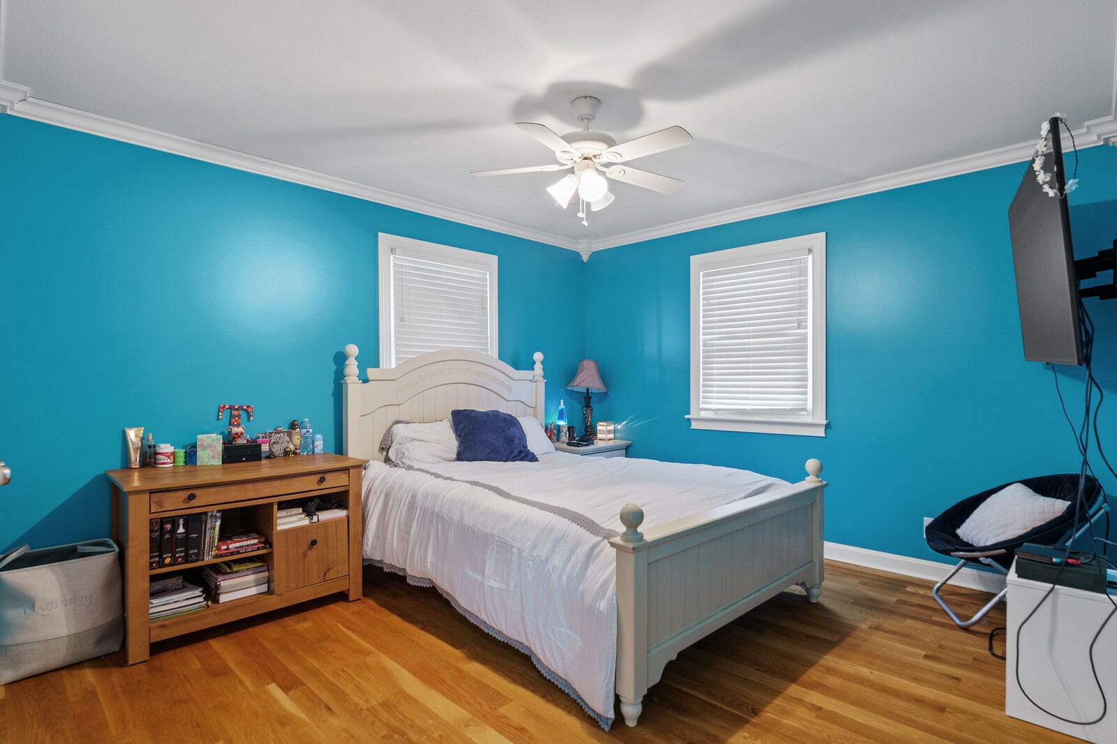 415 Woodruff Road Adams, TN 37010 - Photo 29 of 47 a bedroom with a bed and a chandelier