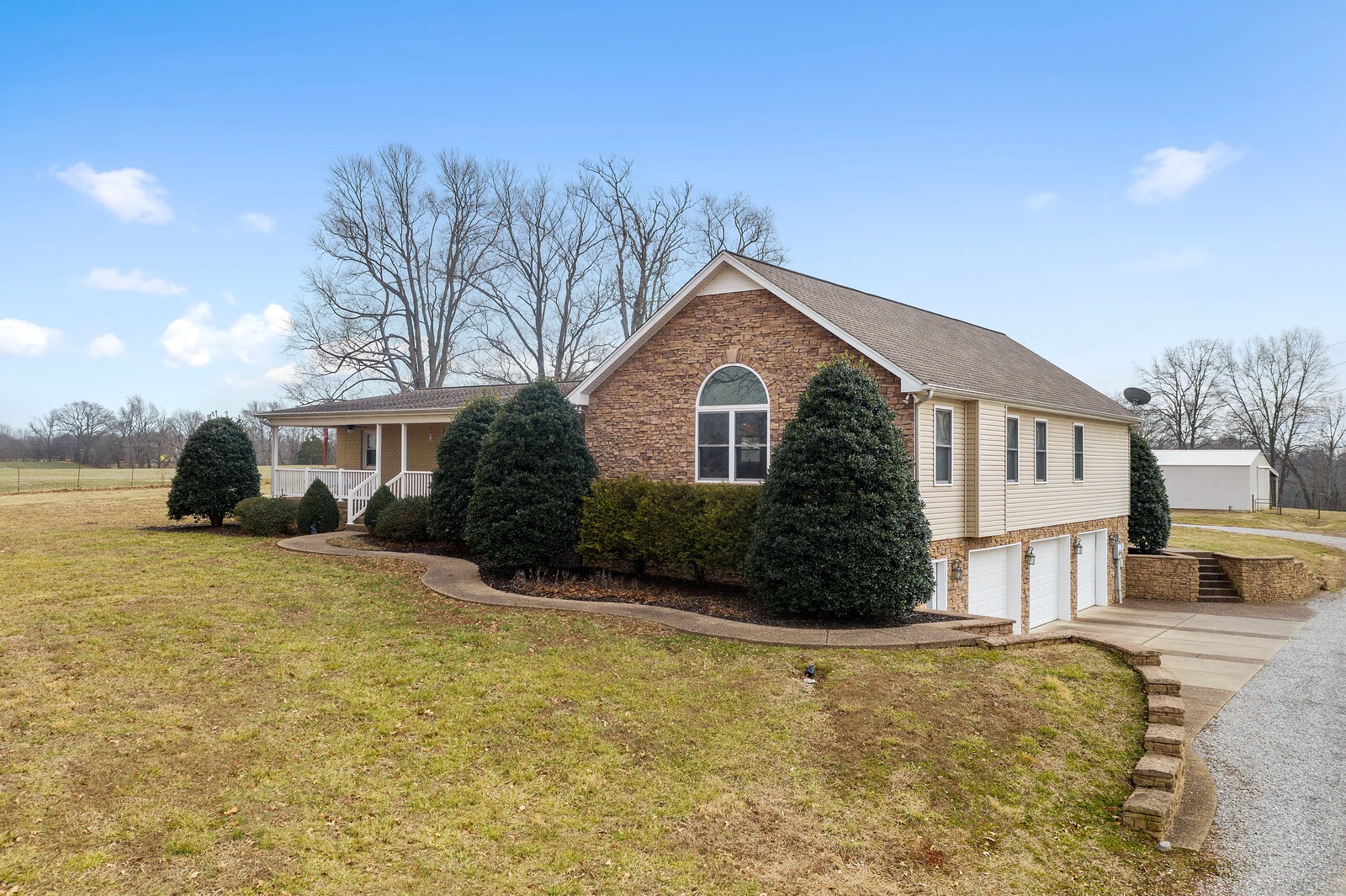 415 Woodruff Road Adams, TN 37010 - Photo 4 of 47 a front view of a house with a yard